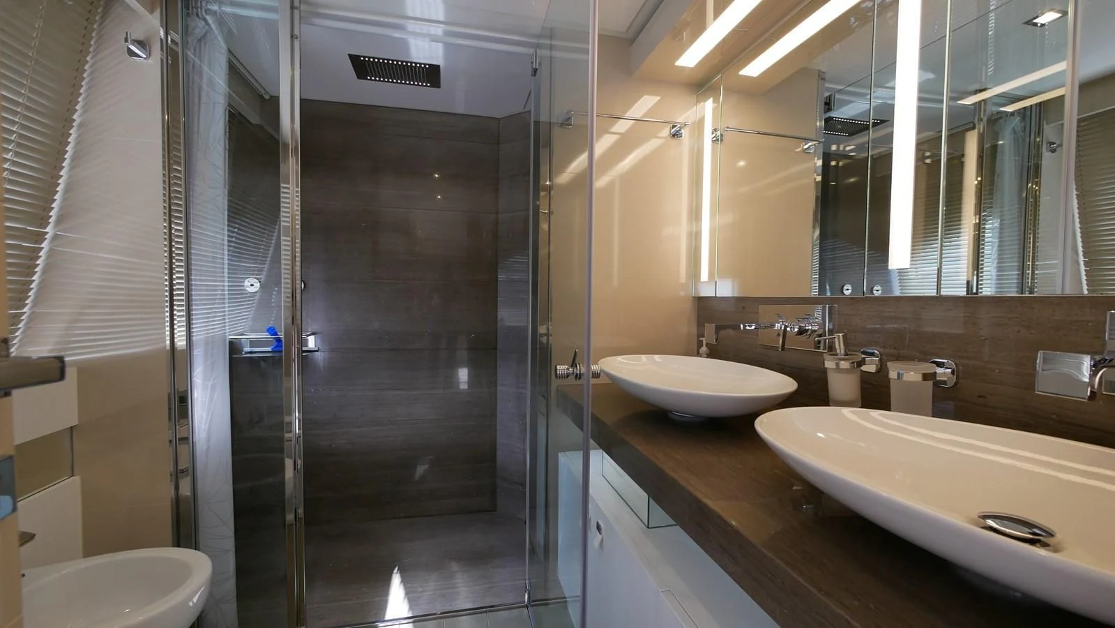 a bathroom with a large glass shower aboard MIOTU 4 Yacht for Sale