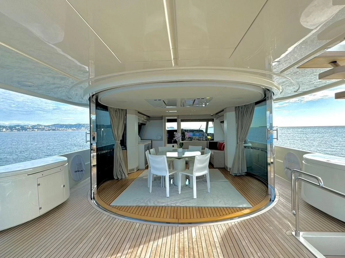 a boat with a table and chairs aboard MIOTU 4 Yacht for Sale