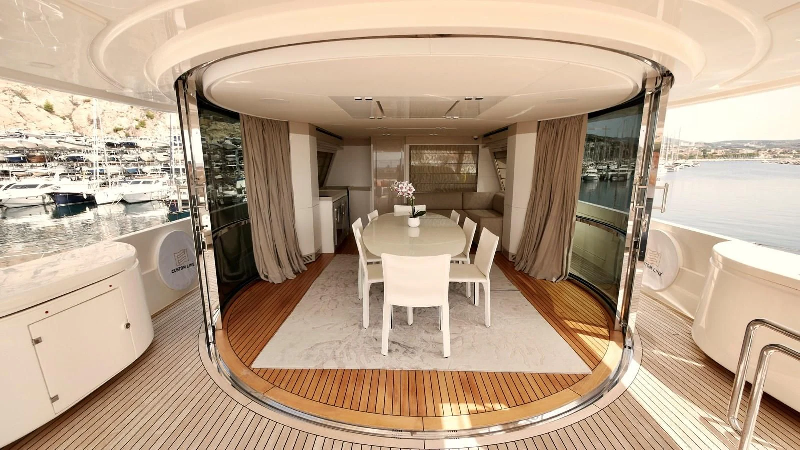 a large bathroom with a table and chairs aboard MIOTU 4 Yacht for Sale
