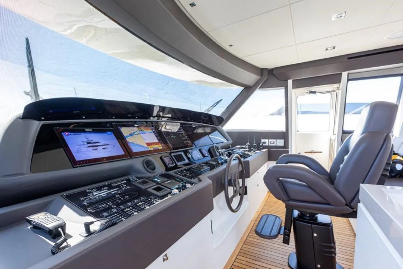 inside of a vehicle with a computer and a chair aboard MIOTU 4 Yacht for Sale