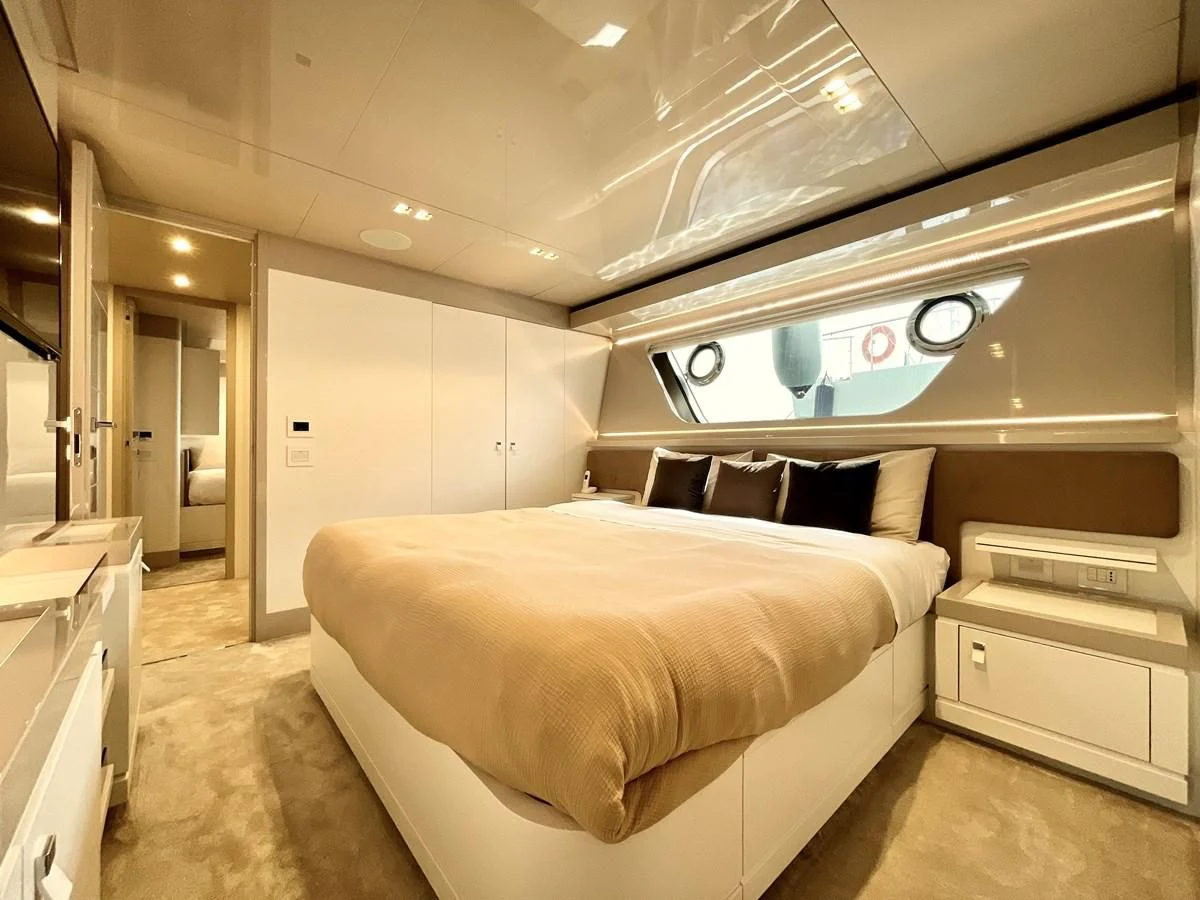 a room with a bed and a desk aboard MIOTU 4 Yacht for Sale