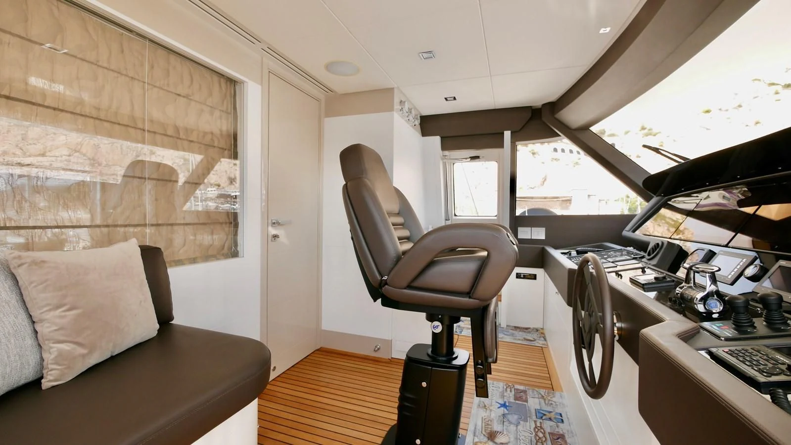 a room with a couch and a desk aboard MIOTU 4 Yacht for Sale