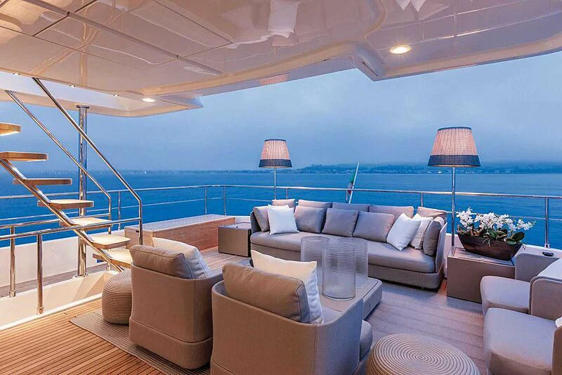 a living room with a large blue ocean aboard MIOTU 4 Yacht for Sale