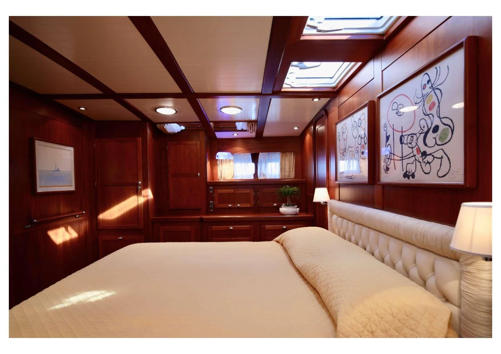 a bed in a room aboard MARELLA Yacht for Sale