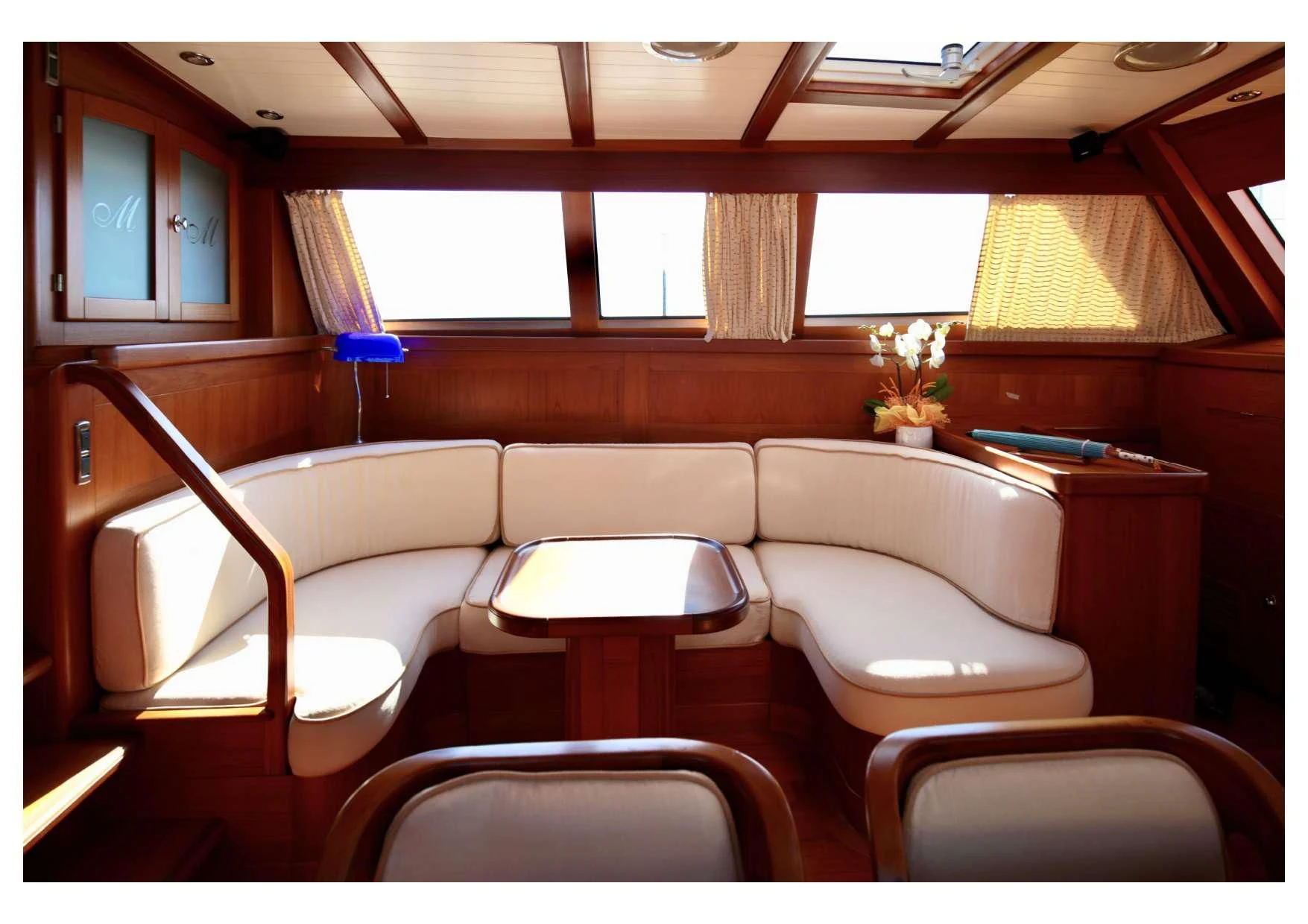 a room with a table and chairs aboard MARELLA Yacht for Sale