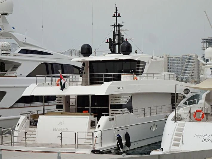 a large white boat aboard NAHAR Yacht for Sale