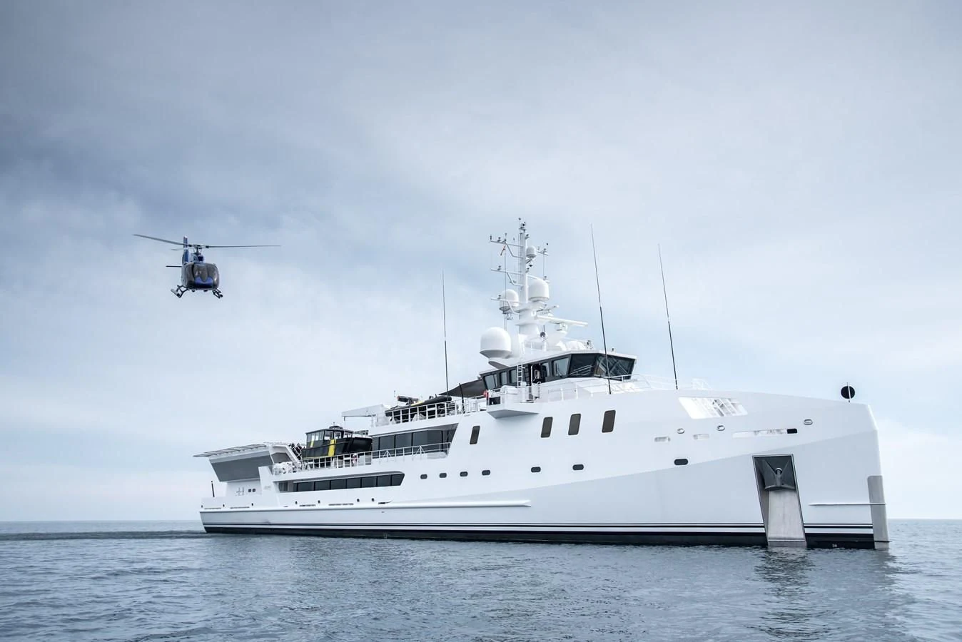 a helicopter flying over a ship aboard GAME CHANGER Yacht for Sale