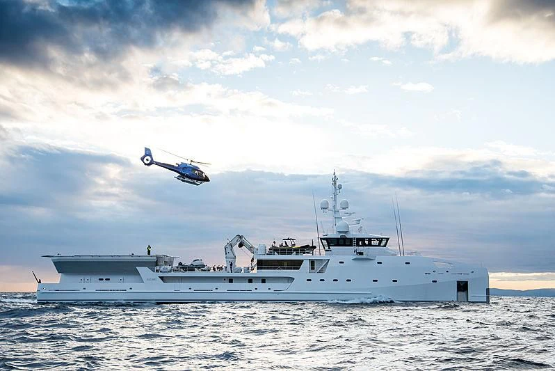 a helicopter flying over a boat aboard GAME CHANGER Yacht for Sale