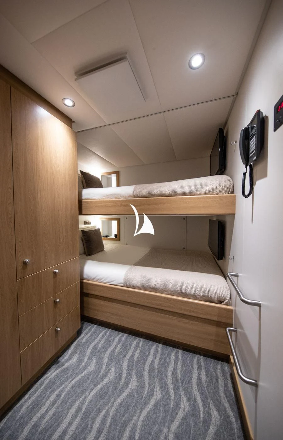 a room with bunk beds aboard GAME CHANGER Yacht for Sale