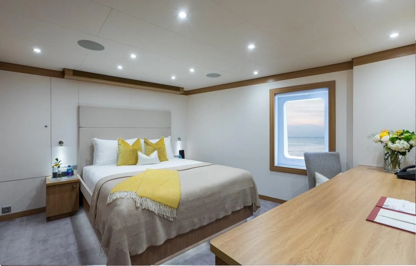 a bedroom with a large bed aboard GAME CHANGER Yacht for Sale