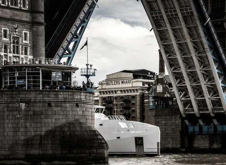 a collage of buildings and a bridge aboard GAME CHANGER Yacht for Sale