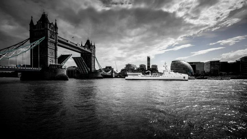 a bridge over water with a boat in the foreground aboard GAME CHANGER Yacht for Sale