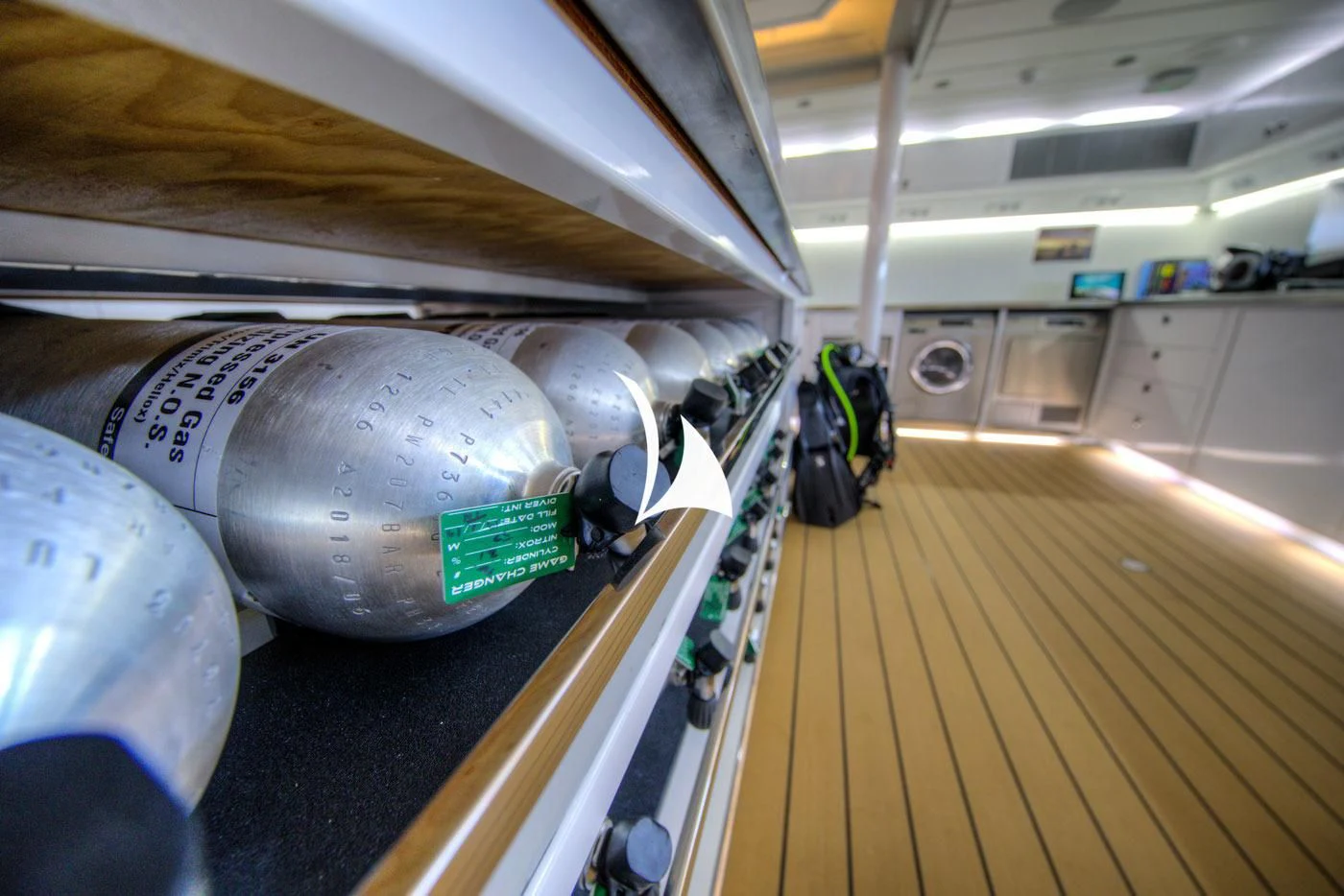 a large metal cylinder in a factory aboard GAME CHANGER Yacht for Sale