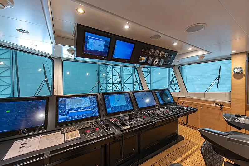 a control room with many monitors aboard GAME CHANGER Yacht for Sale