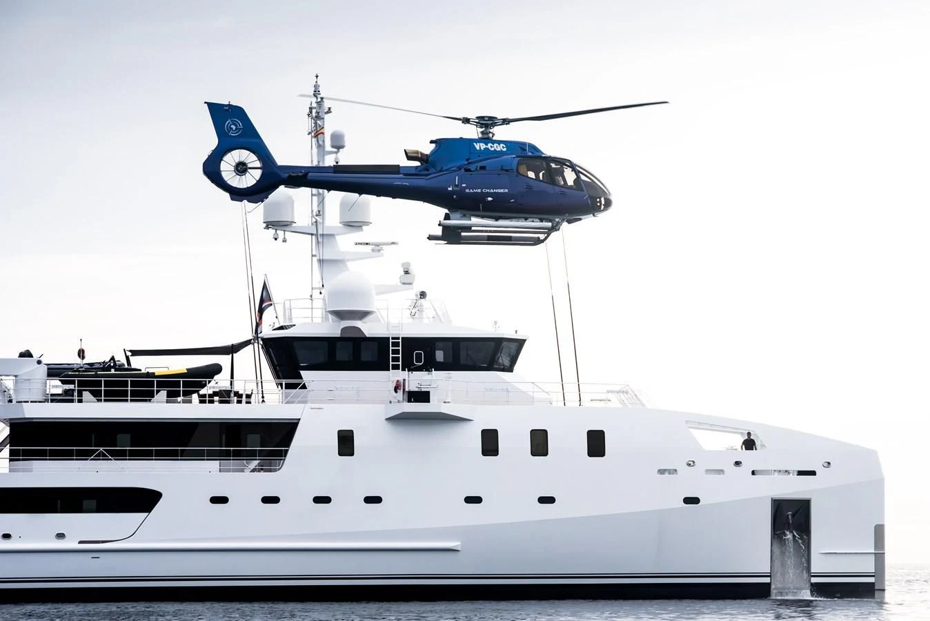 a helicopter flying over a ship aboard GAME CHANGER Yacht for Sale