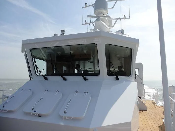a white boat on a dock aboard GAME CHANGER Yacht for Sale