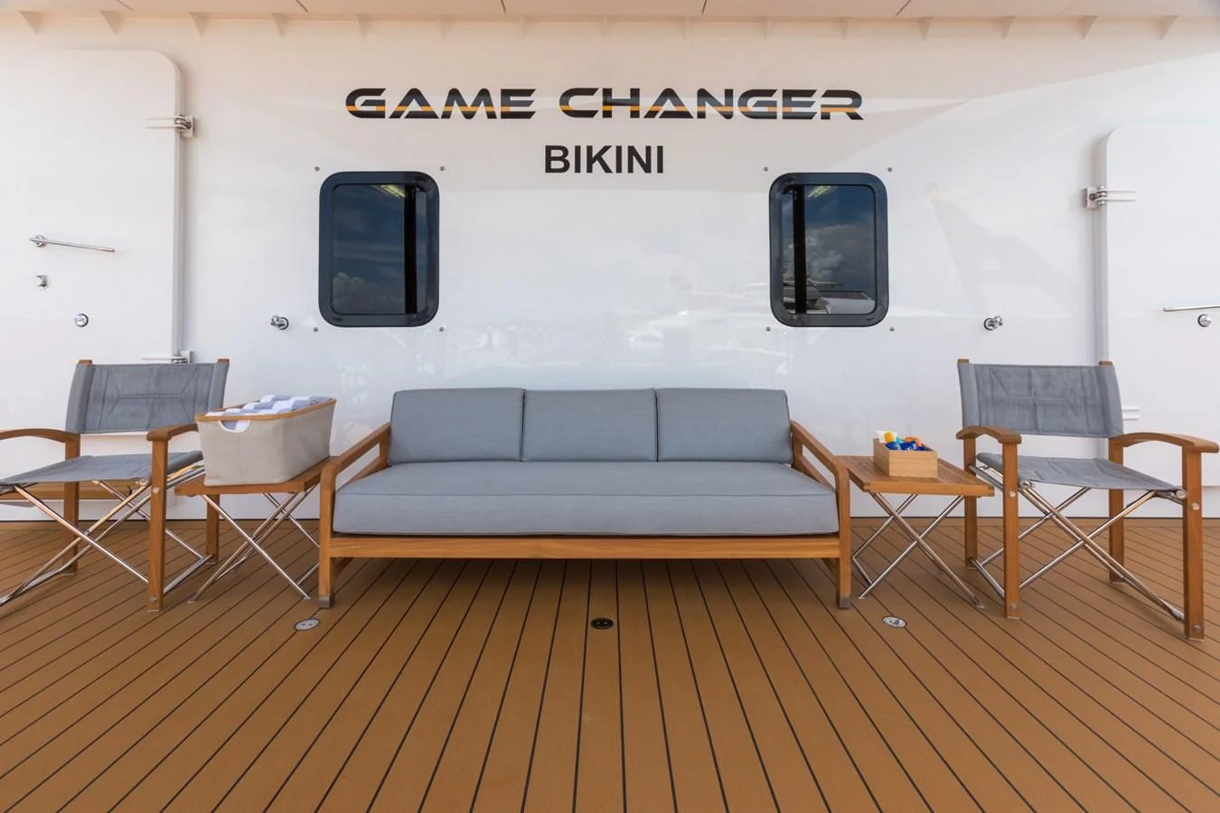a room with a couch and chairs aboard GAME CHANGER Yacht for Sale