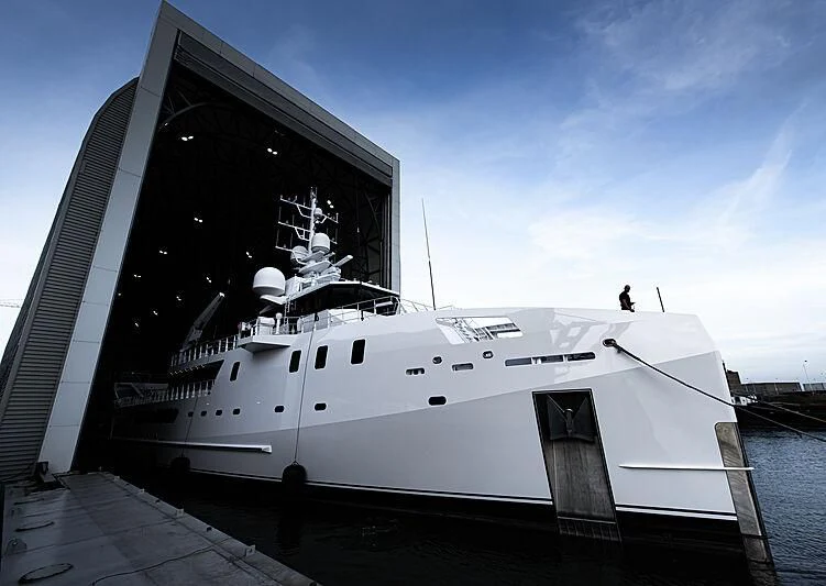 a boat docked at a pier aboard GAME CHANGER Yacht for Sale