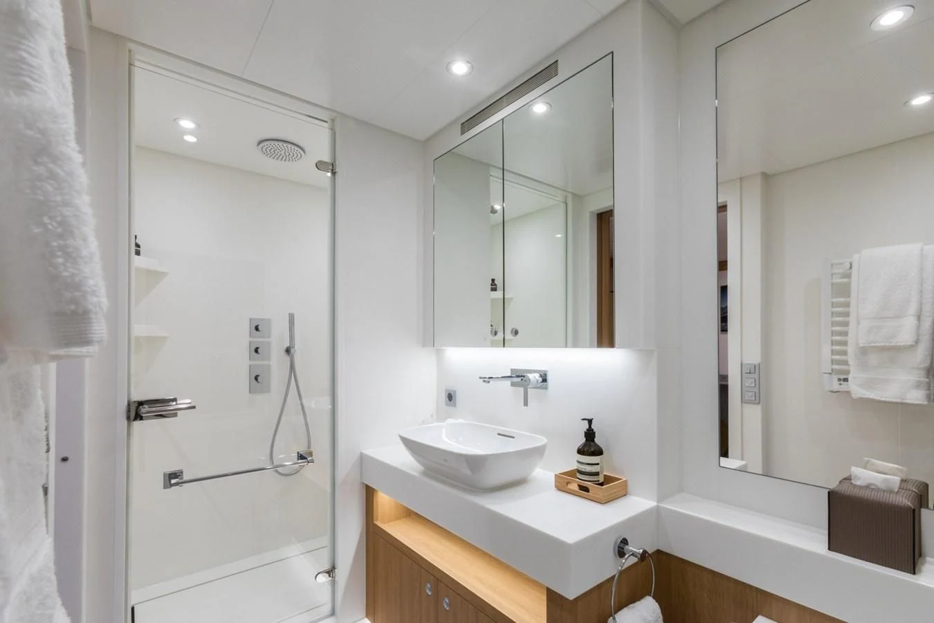 a bathroom with a sink and a mirror aboard GAME CHANGER Yacht for Sale