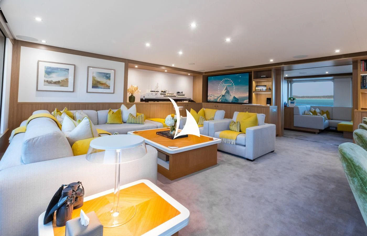 a living room with a couch and a tv aboard GAME CHANGER Yacht for Sale