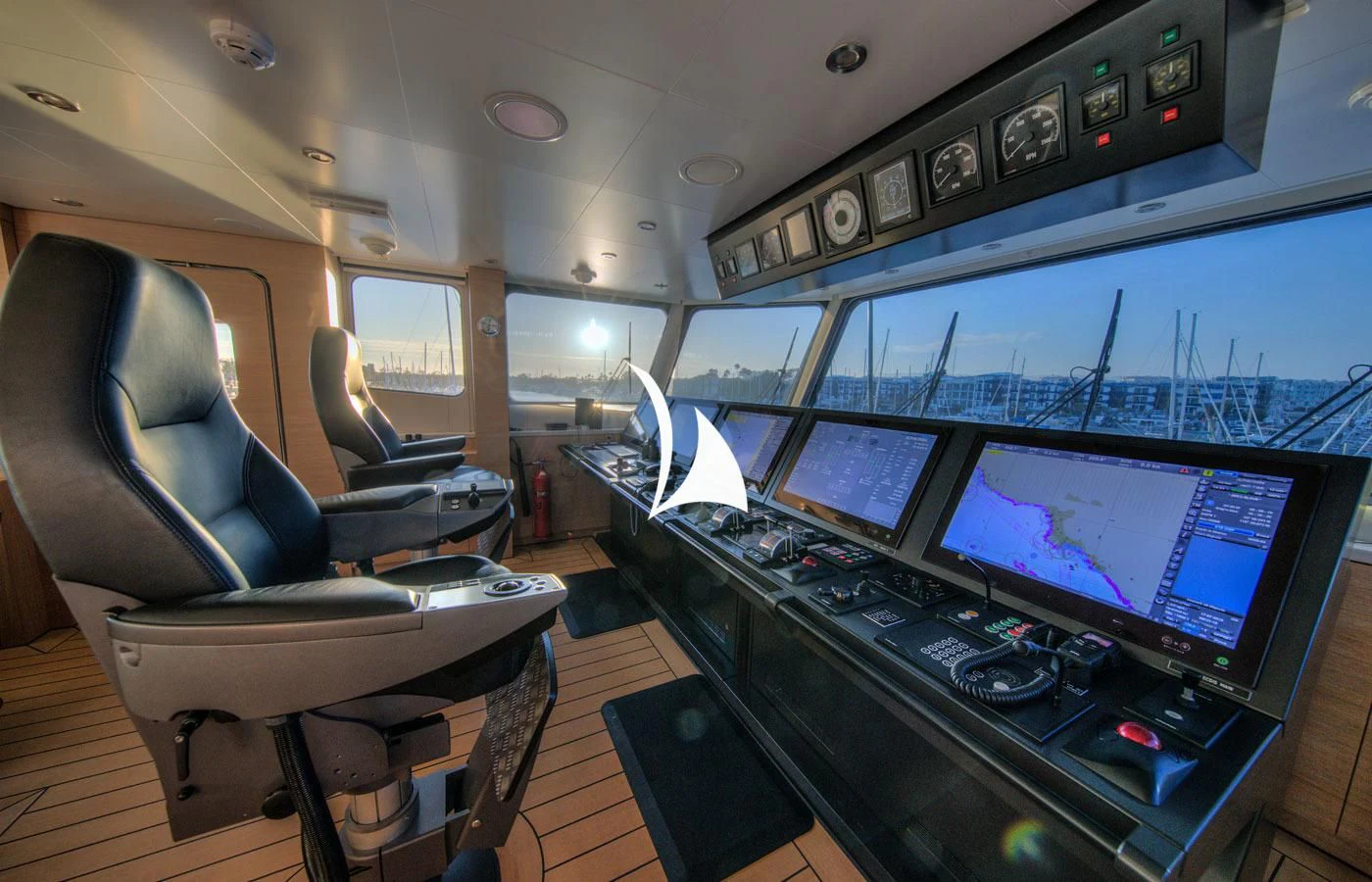 a control room with several monitors aboard GAME CHANGER Yacht for Sale
