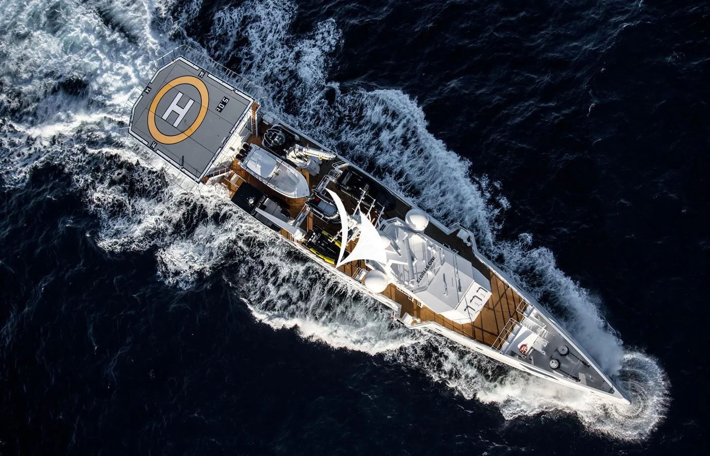 a space shuttle flying over earth aboard GAME CHANGER Yacht for Sale