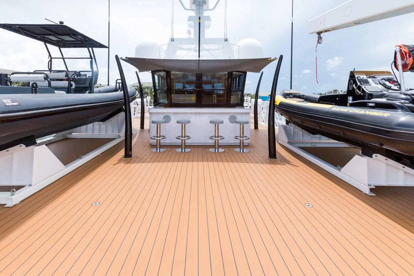 a room with a table and chairs aboard GAME CHANGER Yacht for Sale