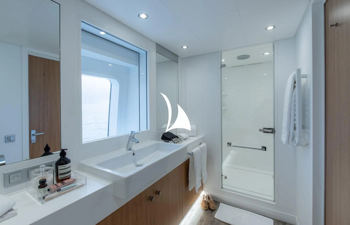 a bathroom with a shower unit and sink aboard GAME CHANGER Yacht for Sale