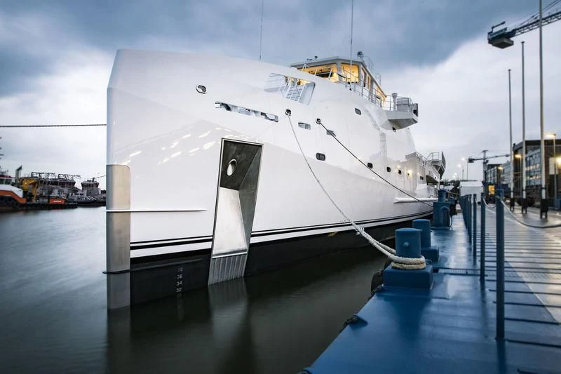 a large white ship docked aboard GAME CHANGER Yacht for Sale