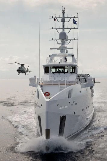 a helicopter flying over a ship aboard GAME CHANGER Yacht for Sale