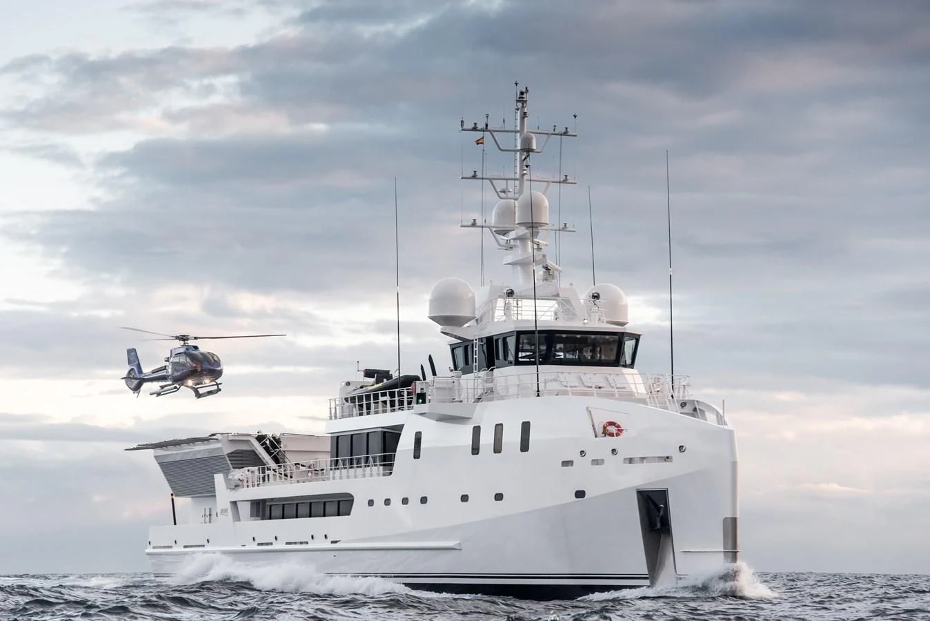 a helicopter flying over a boat aboard GAME CHANGER Yacht for Sale