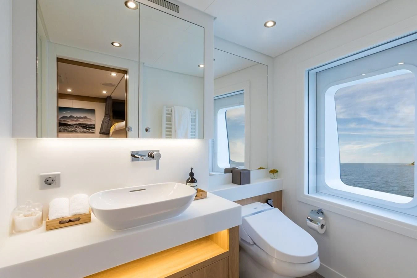 a bathroom with a large mirror aboard GAME CHANGER Yacht for Sale