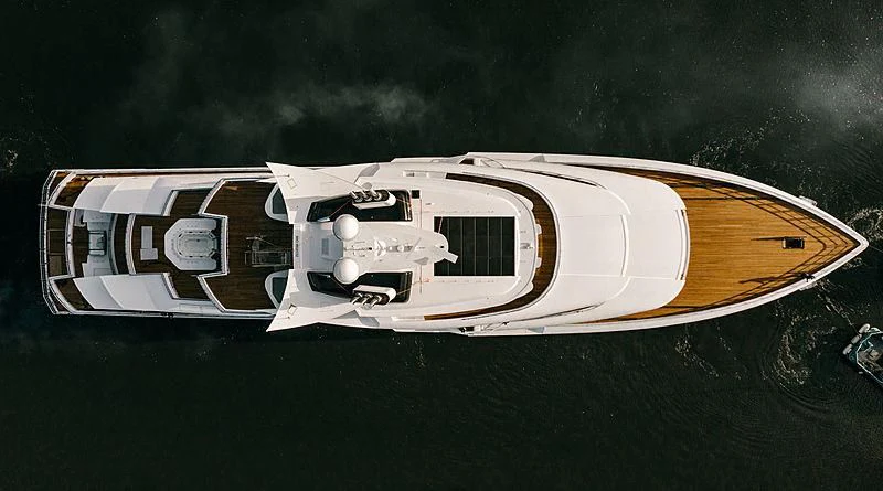 a white and yellow boat on water aboard ARTEFACT Yacht for Sale