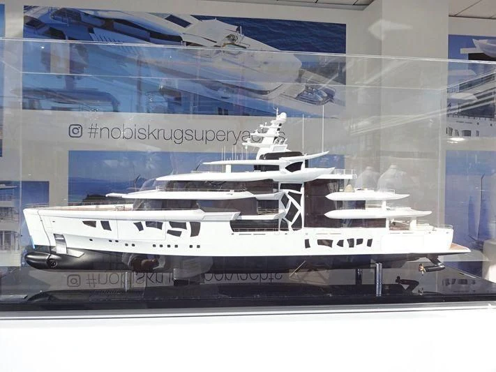 a white yacht in a glass case aboard ARTEFACT Yacht for Sale