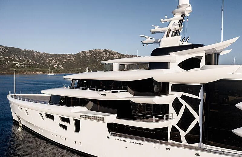 a white yacht on the beach aboard ARTEFACT Yacht for Sale