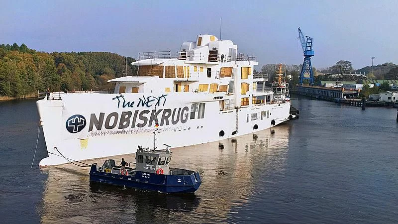 a large ship with a crane on it aboard ARTEFACT Yacht for Sale