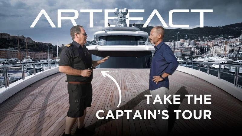 two men standing on a deck aboard ARTEFACT Yacht for Sale