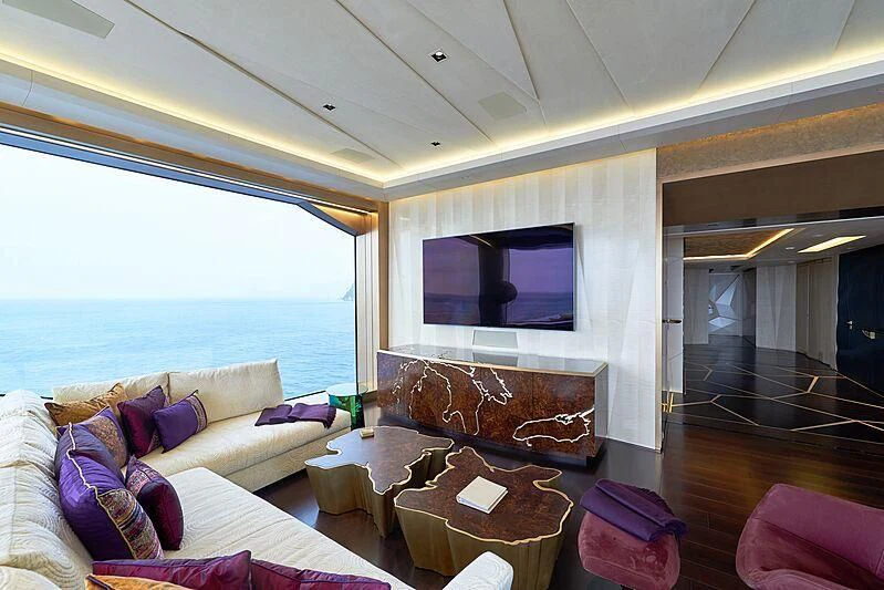 a living room with a large television aboard ARTEFACT Yacht for Sale