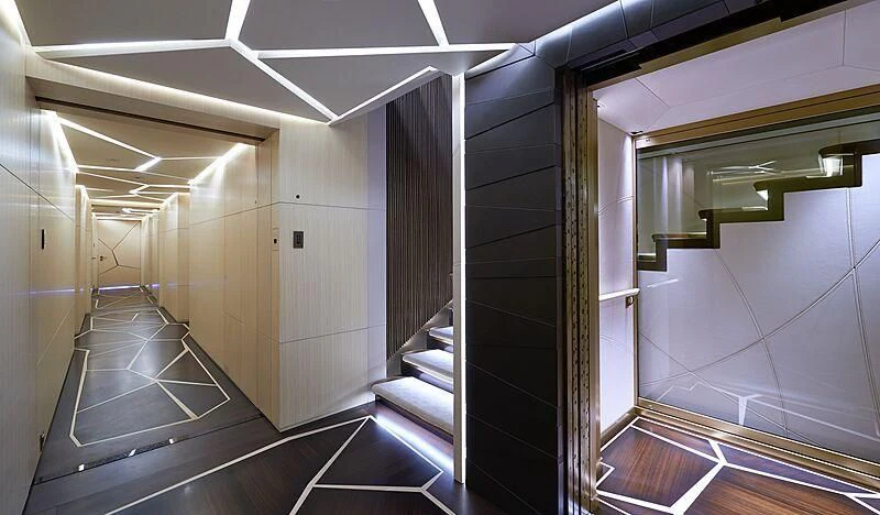 a hallway with a glass door aboard ARTEFACT Yacht for Sale