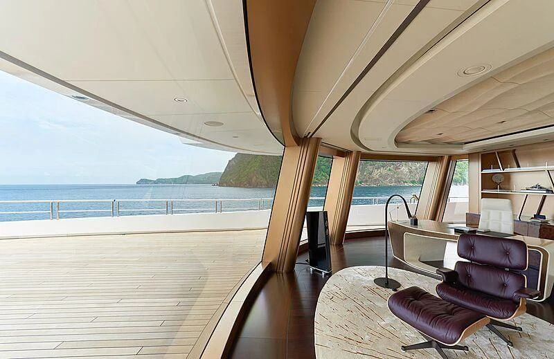 a boat with a deck and chairs aboard ARTEFACT Yacht for Sale