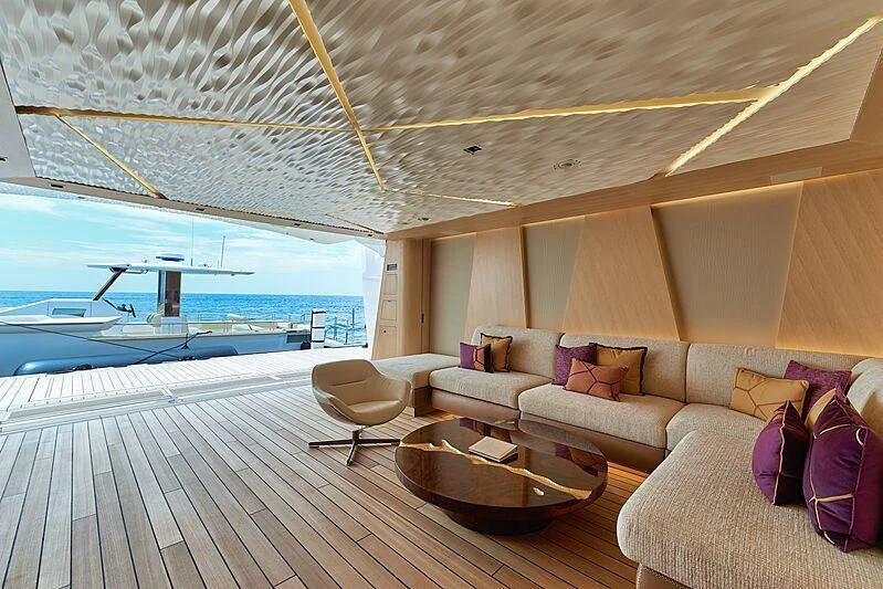 a living room with a large window aboard ARTEFACT Yacht for Sale