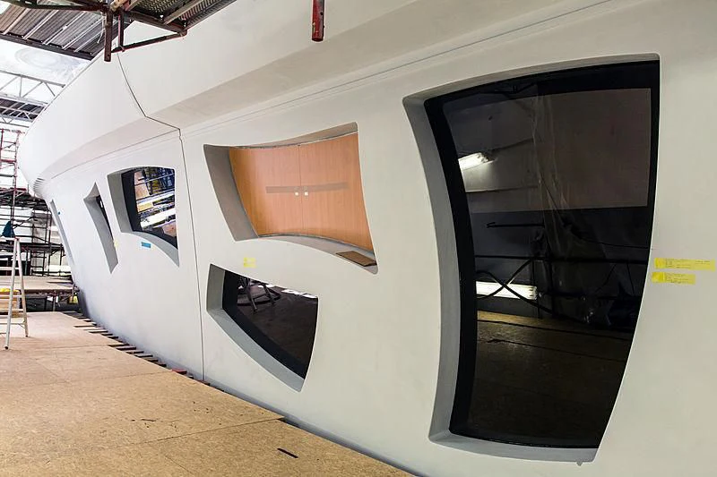 a large white building with windows aboard ARTEFACT Yacht for Sale