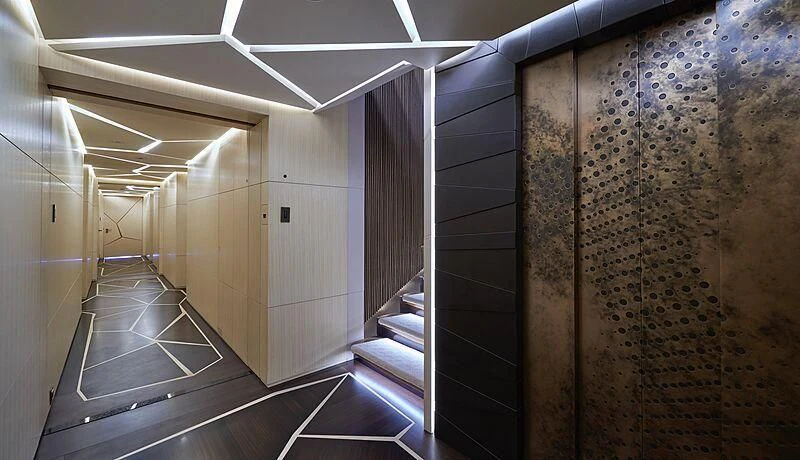 a hallway with a tile wall aboard ARTEFACT Yacht for Sale