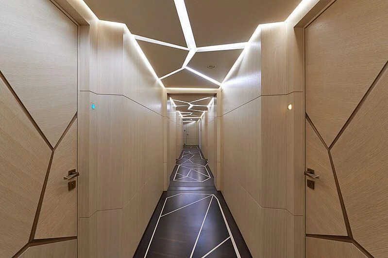 a long hallway with metal railings aboard ARTEFACT Yacht for Sale