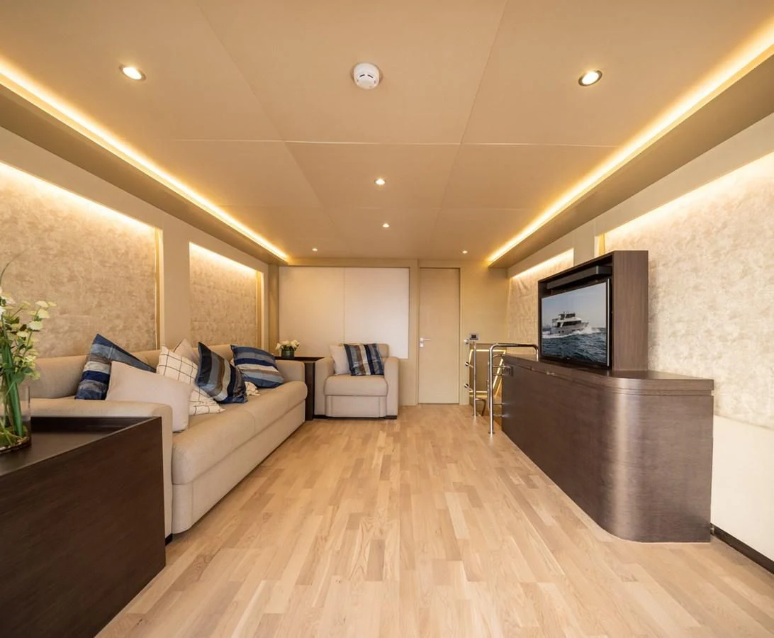 a living room with a wood floor aboard RODINIA 2 Yacht for Sale