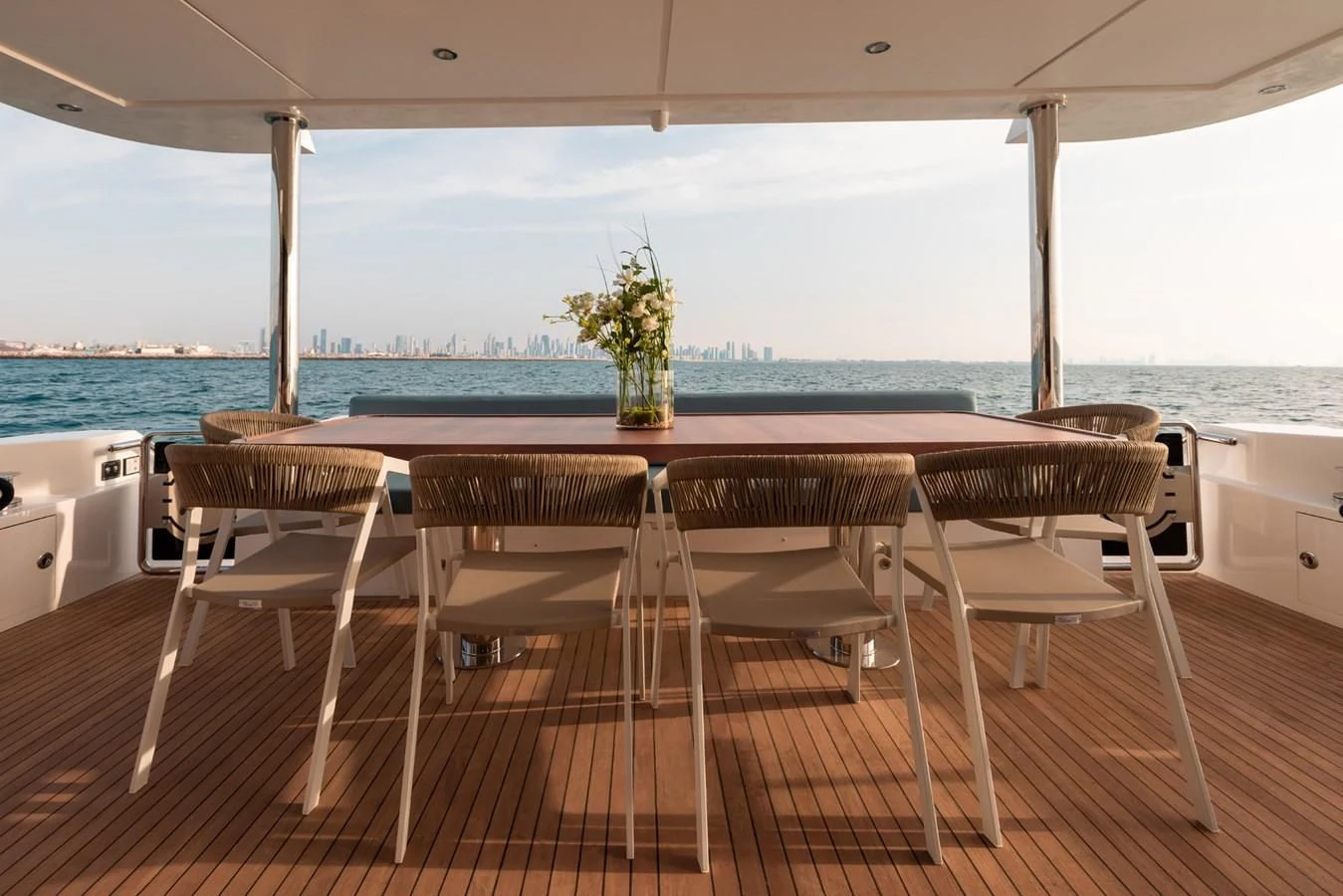 a table and chairs on a balcony aboard RODINIA 2 Yacht for Sale