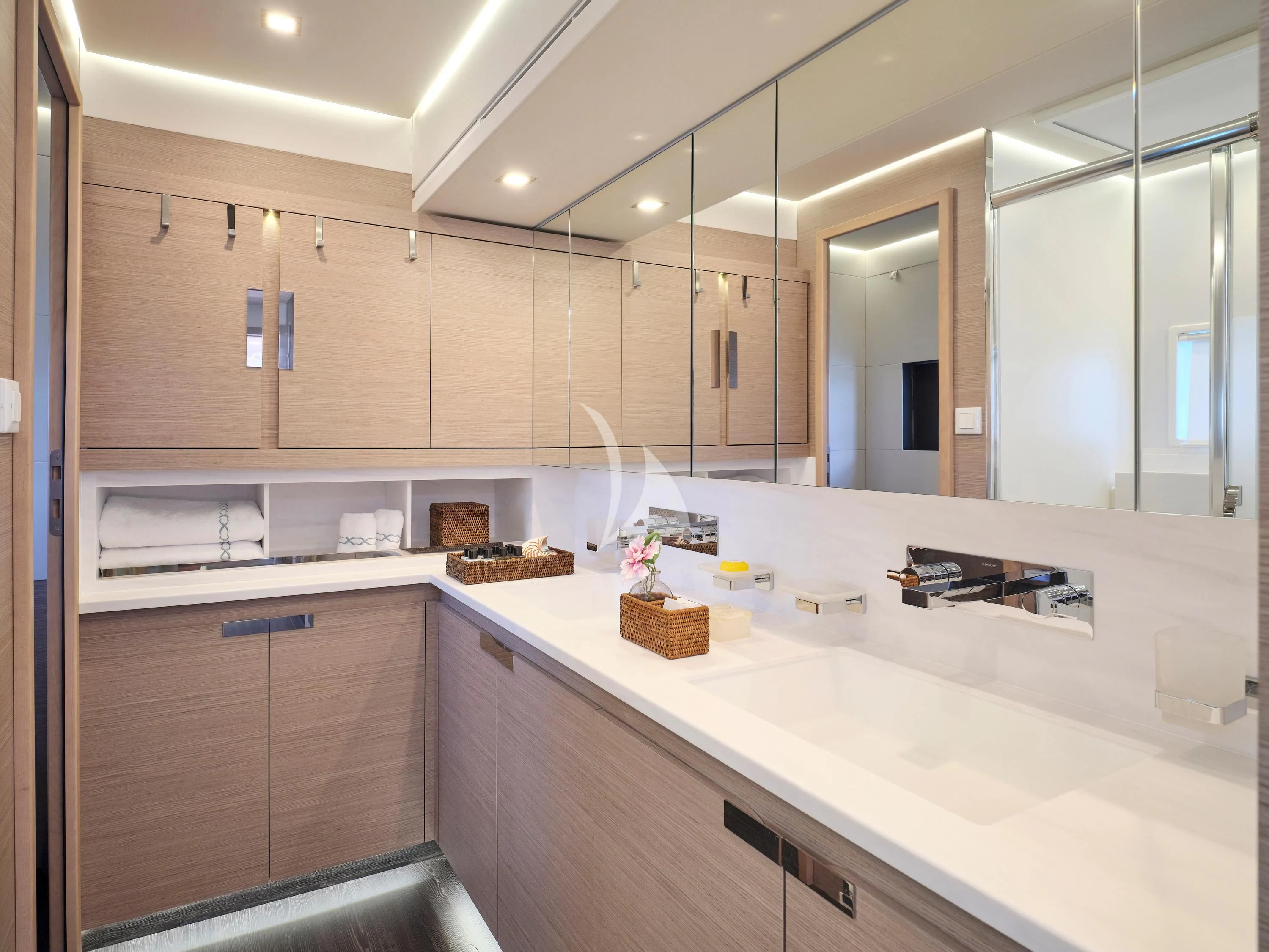 a bathroom with a sink and cabinets aboard KIMATA Yacht for Charter