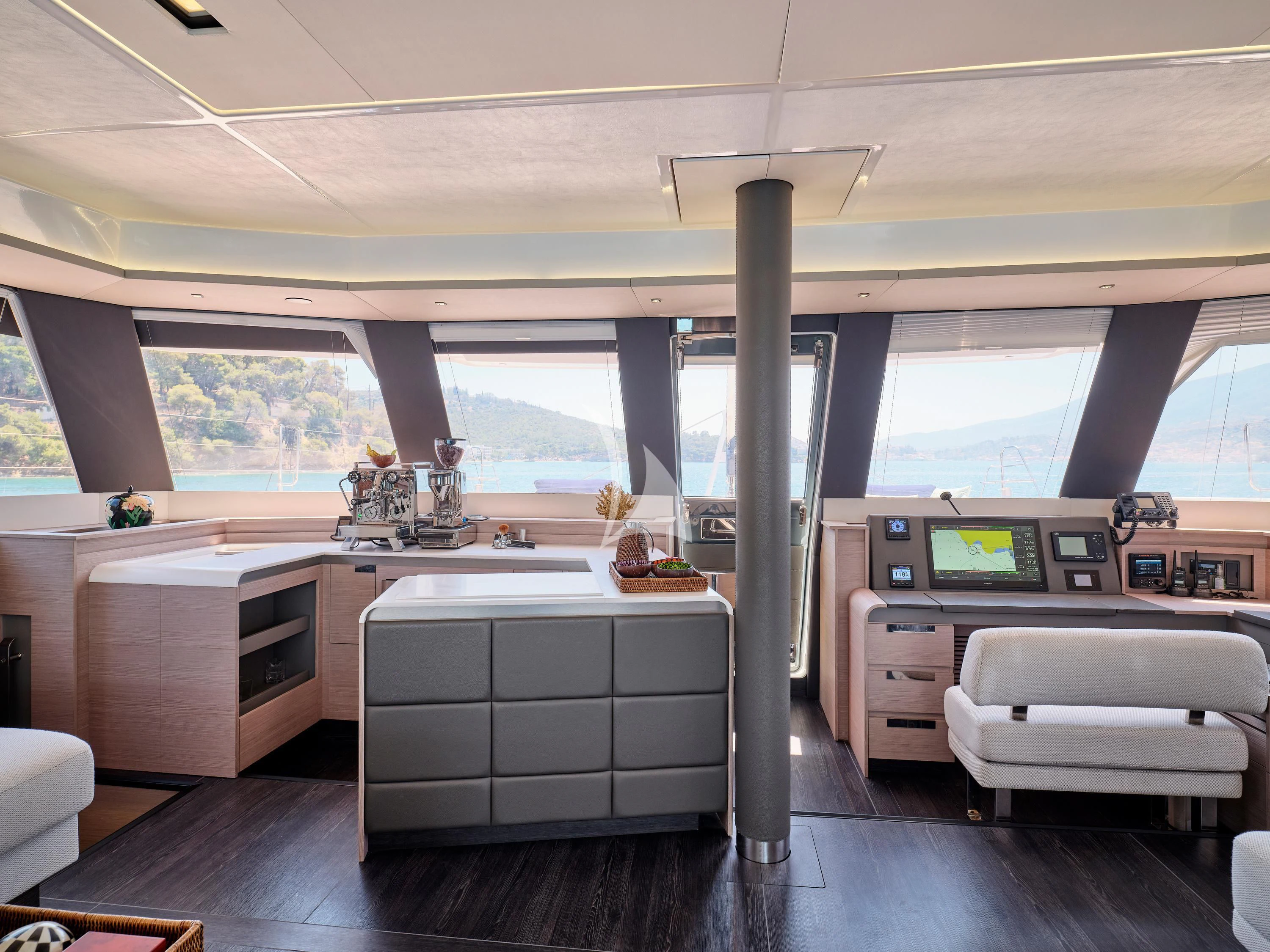 a large kitchen with a large window aboard KIMATA Yacht for Charter