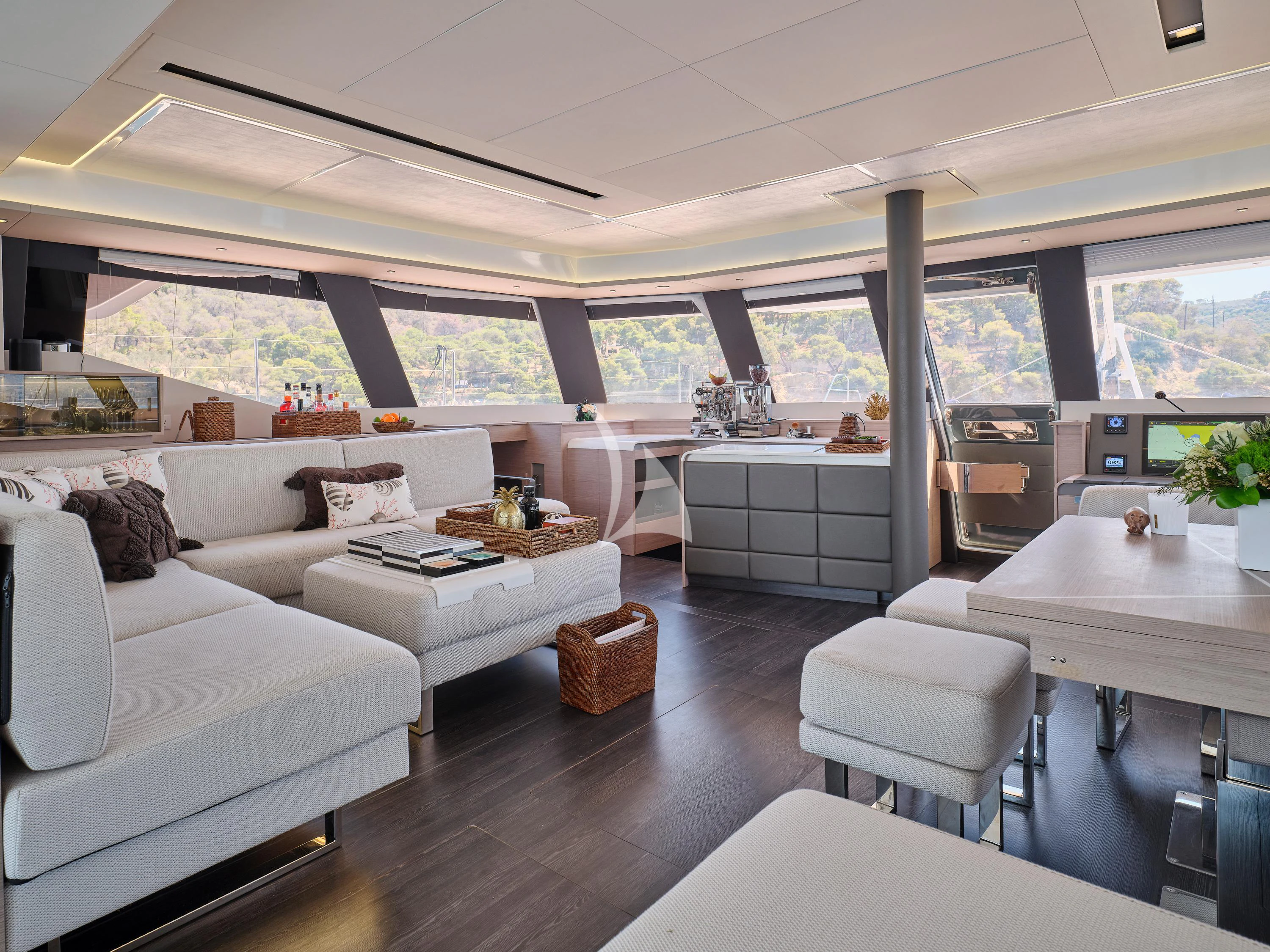 a living room with a large window aboard KIMATA Yacht for Charter