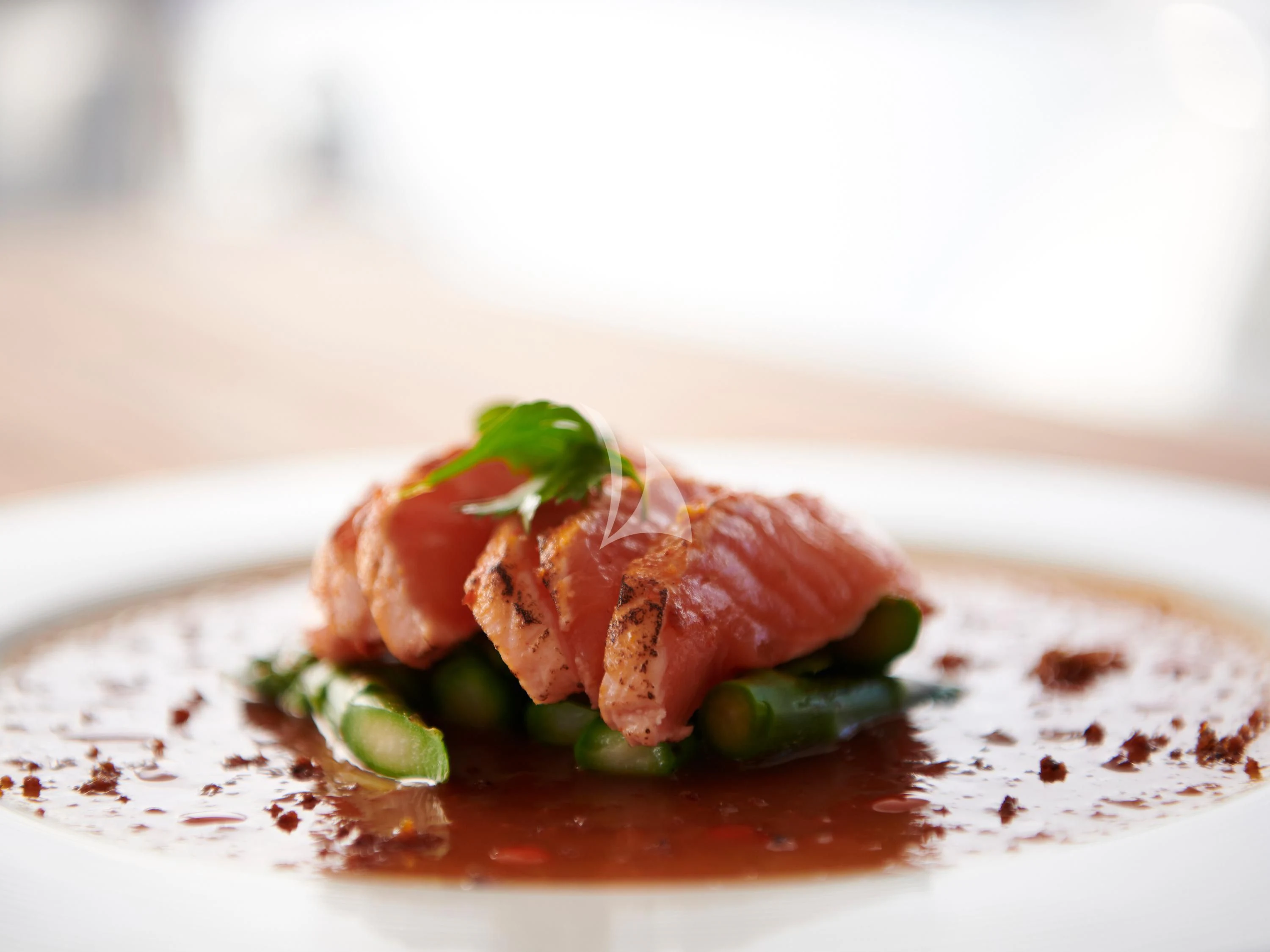 a piece of meat on a plate aboard KIMATA Yacht for Charter